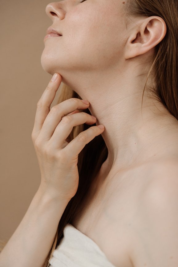 Woman With Long Hair Sensuality Touching Neck By Fingers.